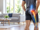 Man holding his buttock with an illustration of sciatic nerve pain extending down the leg